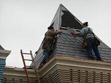 Workers Repairing Roof