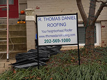 Workers Repairing Roof